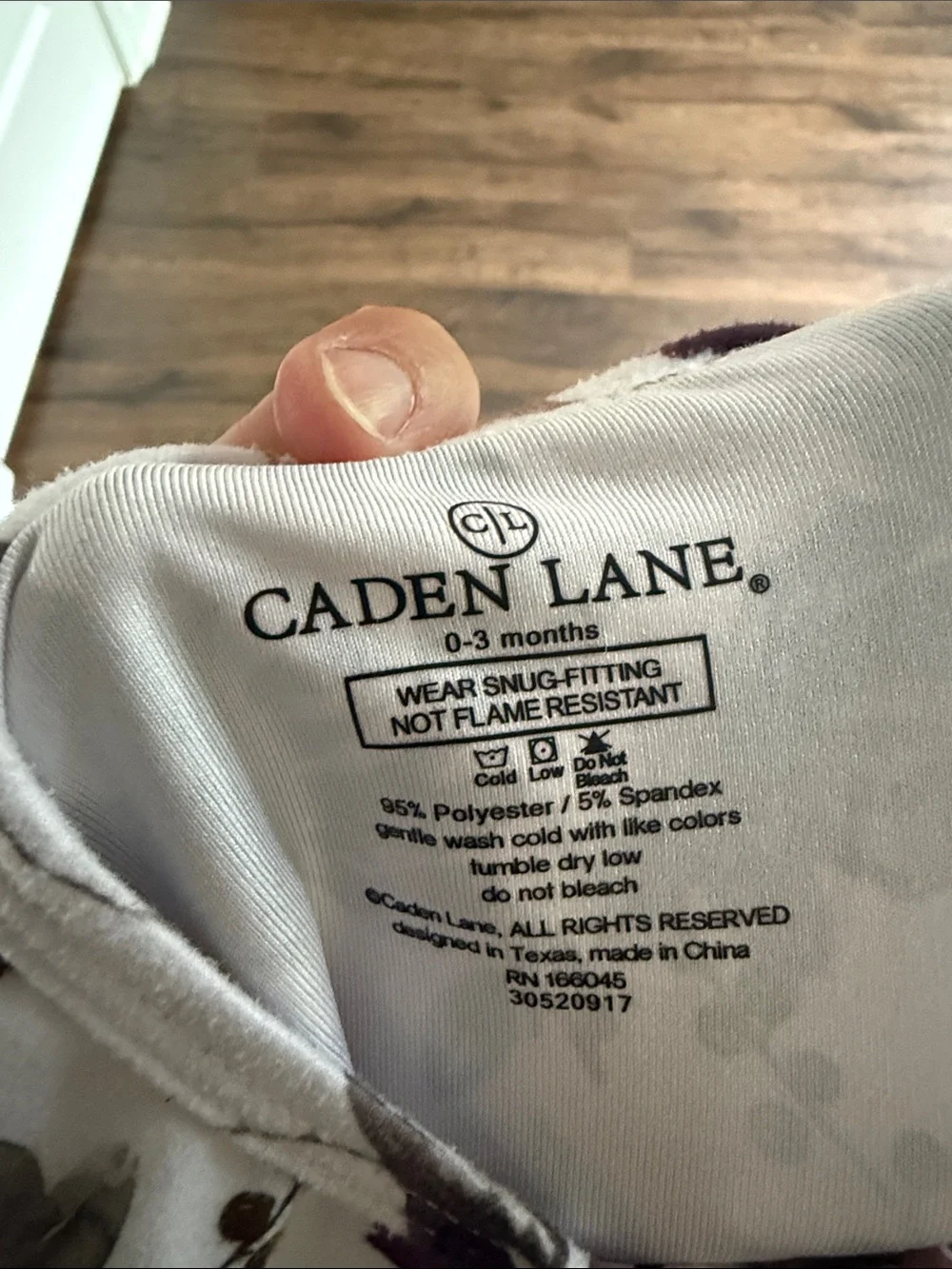 Caden Lane Floral Footed One-Piece in Cream and Plum